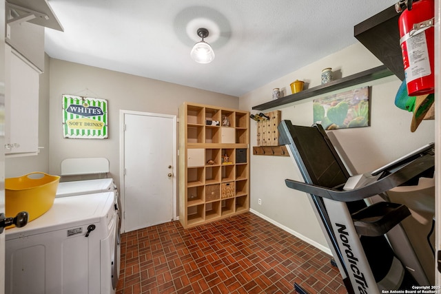 308 Sagecrest, Hollywood Park, TX 78232 - workout area with washer and dryer, brick patterned floors, and baseboards
