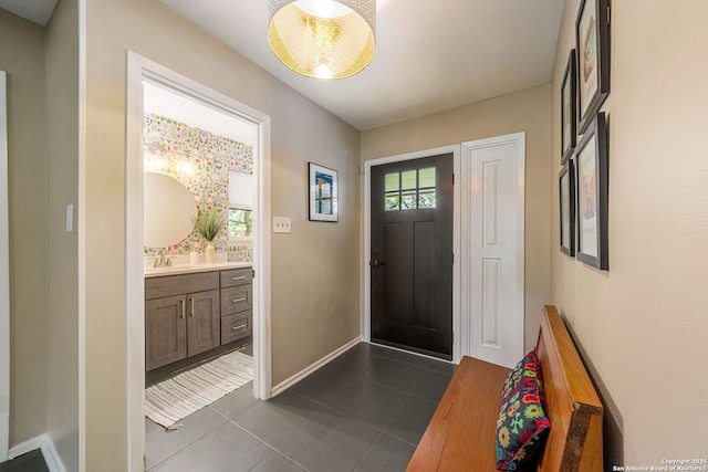 308 Sagecrest, Hollywood Park, TX 78232 - foyer entrance featuring dark tile patterned flooring and baseboards