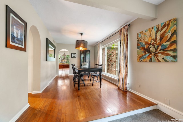 308 Sagecrest, Hollywood Park, TX 78232 - dining area featuring arched walkways, wood-type flooring, and baseboards