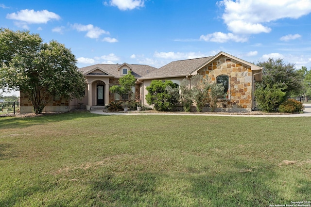 438 County Road 367, Hondo, TX 78861 - view of front of property featuring stone siding and a front lawn