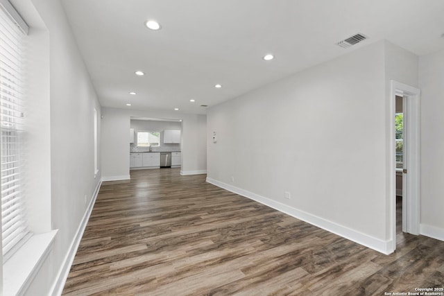 129 Odell, San Antonio, TX 78212 - unfurnished living room featuring recessed lighting, wood finished floors, and baseboards