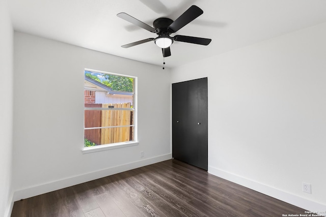5026 Lakewood, San Antonio, TX 78220 - spare room featuring baseboards, dark wood-type flooring, and ceiling fan