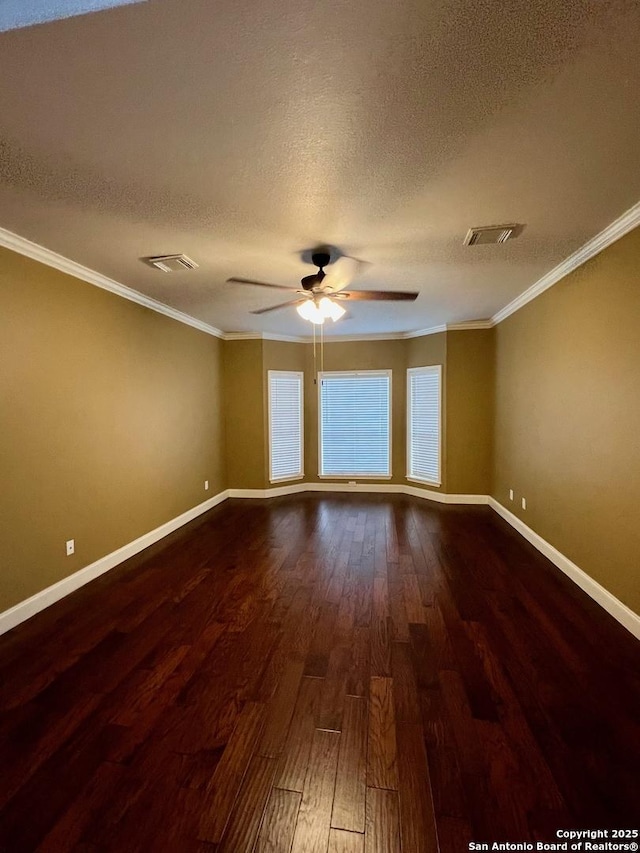 5014 Ashton Audrey, San Antonio, TX 78249 - spare room featuring dark wood-style flooring, ceiling fan, a textured ceiling, ornamental molding, and baseboards