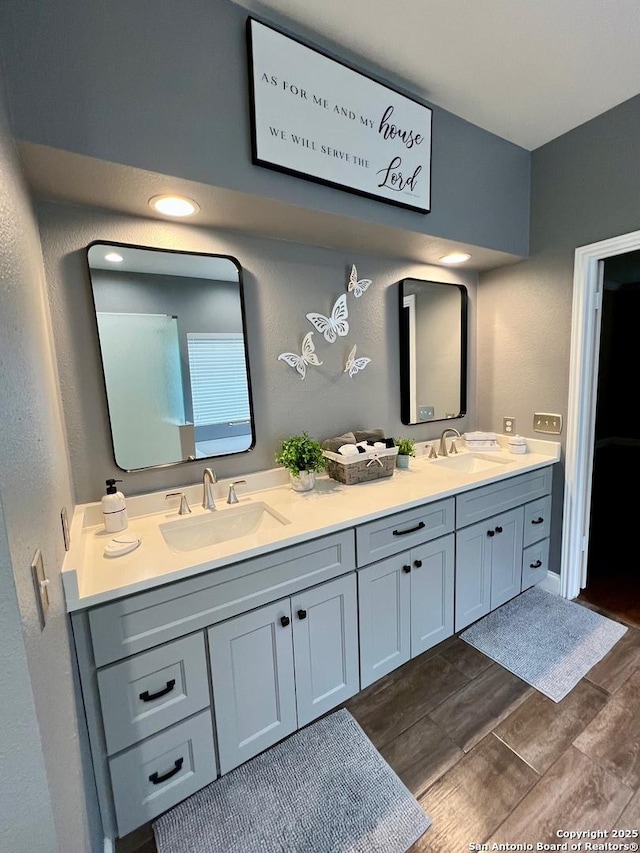 5014 Ashton Audrey, San Antonio, TX 78249 - bathroom featuring double vanity and wood finished floors
