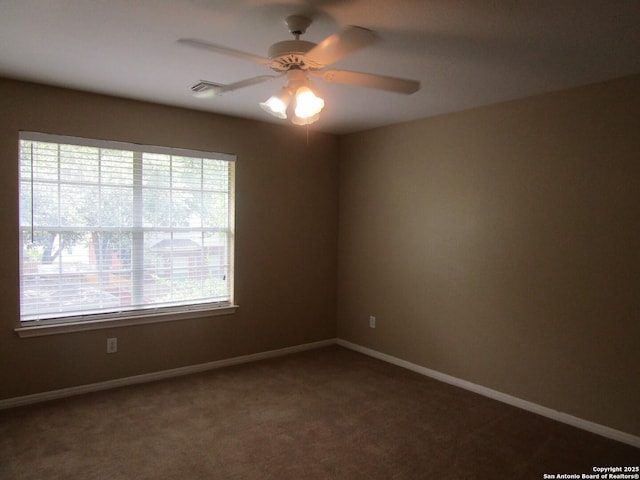 5014 Ashton Audrey, San Antonio, TX 78249 - spare room with healthy amount of natural light, a ceiling fan, carpet flooring, and baseboards