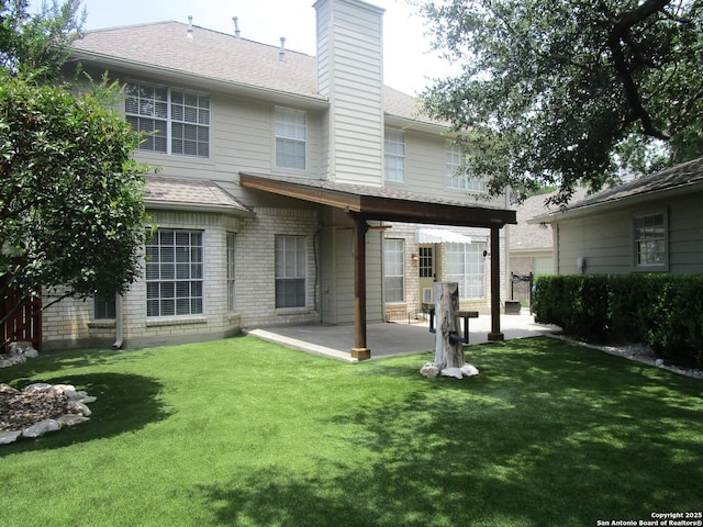 5014 Ashton Audrey, San Antonio, TX 78249 - rear view of house with a patio, a yard, and a shingled roof