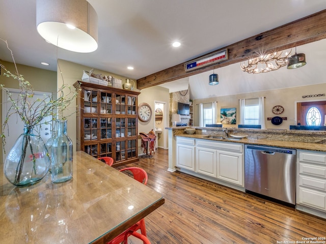 1614 Sunnybrook, New Braunfels, TX 78130 - kitchen featuring stainless steel dishwasher, white cabinetry, a sink, wood finished floors, and beamed ceiling
