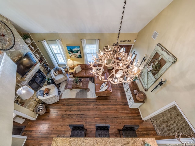 1614 Sunnybrook, New Braunfels, TX 78130 - living area with hardwood / wood-style floors, a chandelier, vaulted ceiling, and a fireplace