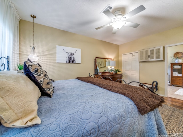 1614 Sunnybrook, New Braunfels, TX 78130 - bedroom featuring wood finished floors, ceiling fan, and a closet