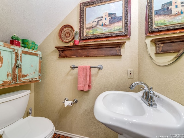 1614 Sunnybrook, New Braunfels, TX 78130 - half bath featuring a sink, toilet, and wood finished floors