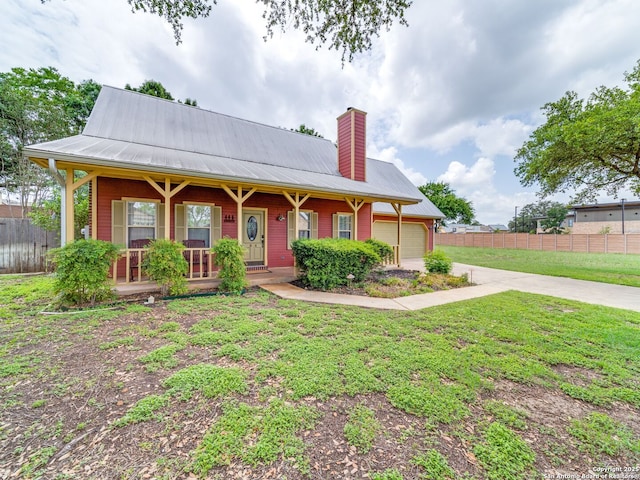 1614 Sunnybrook, New Braunfels, TX 78130 - view of front of home with a garage, a chimney, covered porch, metal roof, and driveway