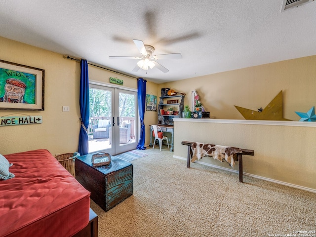 1614 Sunnybrook, New Braunfels, TX 78130 - bedroom featuring access to outside, carpet floors, a textured ceiling, a ceiling fan, and french doors