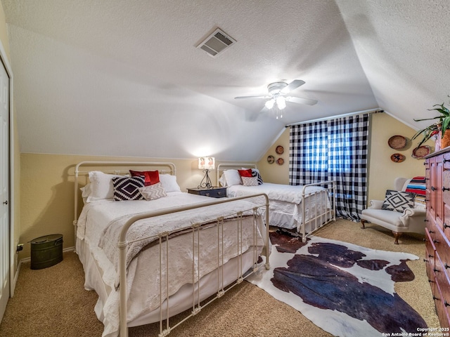 1614 Sunnybrook, New Braunfels, TX 78130 - bedroom featuring carpet flooring, lofted ceiling, a textured ceiling, and a ceiling fan
