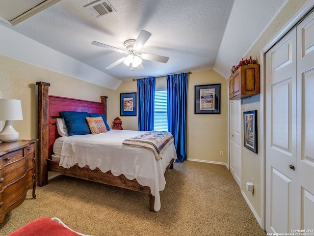 1614 Sunnybrook, New Braunfels, TX 78130 - bedroom with vaulted ceiling, light carpet, a textured ceiling, a ceiling fan, and a closet