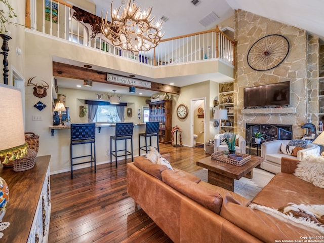 1614 Sunnybrook, New Braunfels, TX 78130 - living area featuring hardwood / wood-style flooring, high vaulted ceiling, baseboards, a chandelier, and a fireplace