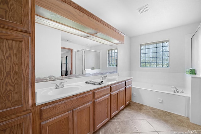 14053 Huber, Seguin, TX 78155 - bathroom featuring a bath, double vanity, tile patterned floors, and a shower with shower door