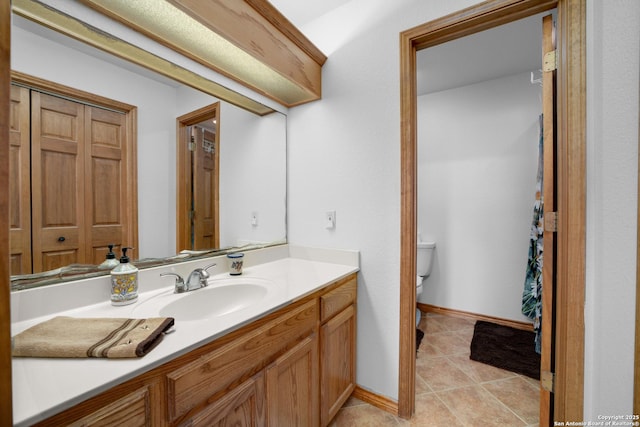 14053 Huber, Seguin, TX 78155 - bathroom with vanity, toilet, tile patterned floors, and baseboards