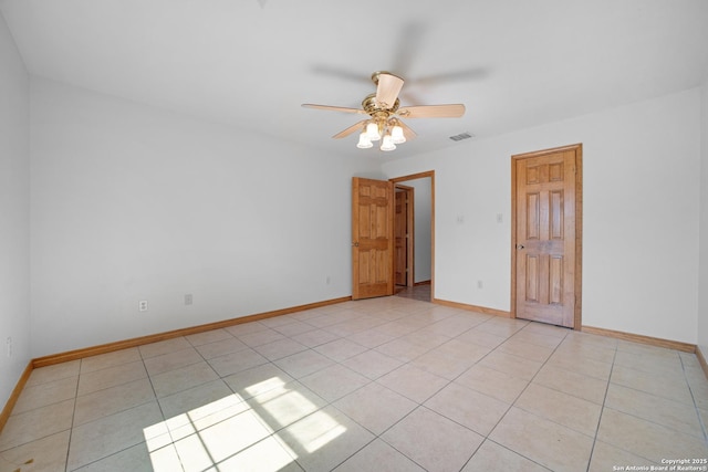 14053 Huber, Seguin, TX 78155 - spare room with ceiling fan, baseboards, and light tile patterned flooring