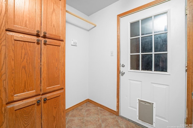 14053 Huber, Seguin, TX 78155 - doorway with baseboards and light tile patterned floors