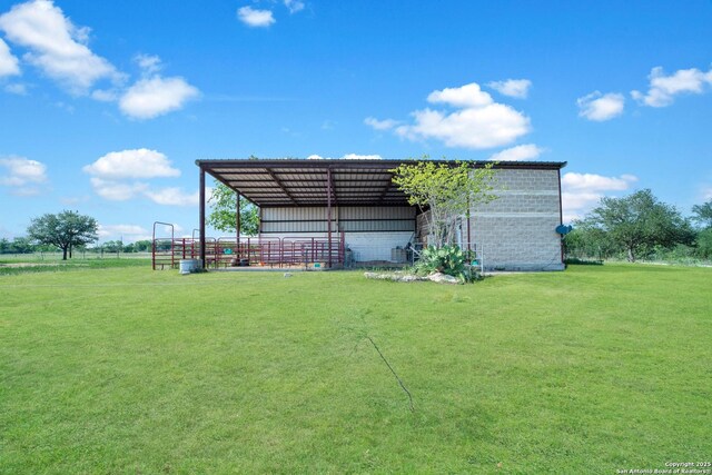 14053 Huber, Seguin, TX 78155 - view of pole building featuring a lawn and a detached carport