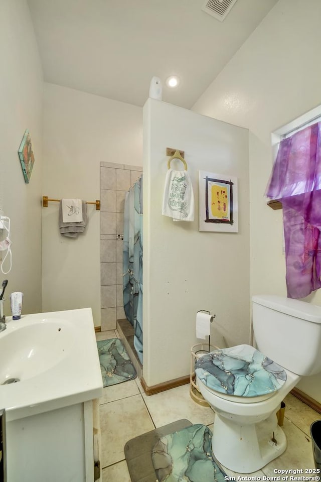 14053 Huber, Seguin, TX 78155 - bathroom with toilet, vanity, a shower with curtain, and tile patterned floors