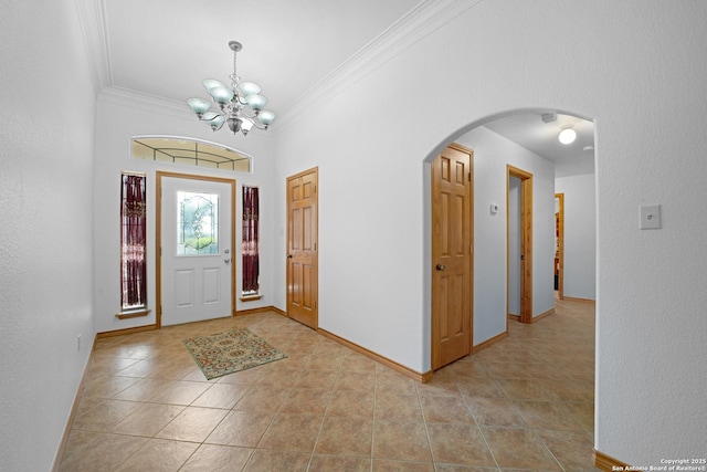 14053 Huber, Seguin, TX 78155 - tiled foyer entrance featuring ornamental molding, arched walkways, a chandelier, and baseboards