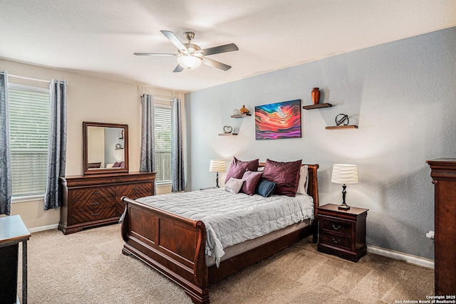 2196 New Castle, New Braunfels, TX 78130 - bedroom featuring light colored carpet, baseboards, and a ceiling fan