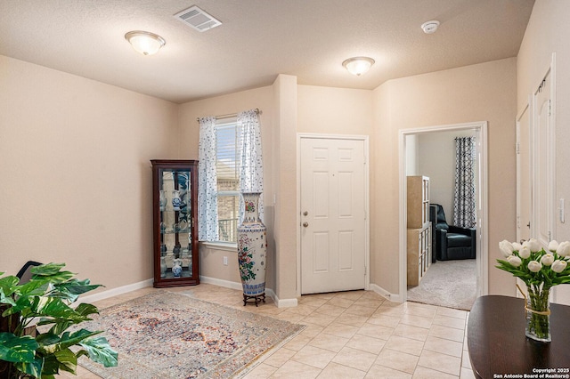 2196 New Castle, New Braunfels, TX 78130 - foyer featuring light tile patterned floors and baseboards