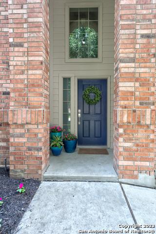 331 Primrose, New Braunfels, TX 78132 - doorway to property with brick siding