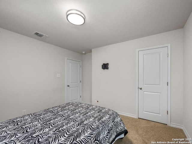 22146 Pivot Pt, San Antonio, TX 78261 - bedroom with light colored carpet and baseboards