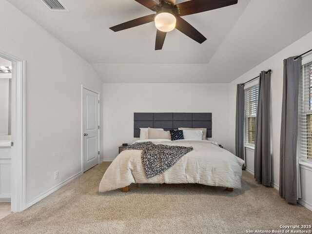 22146 Pivot Pt, San Antonio, TX 78261 - bedroom with light carpet, lofted ceiling, connected bathroom, baseboards, and a ceiling fan