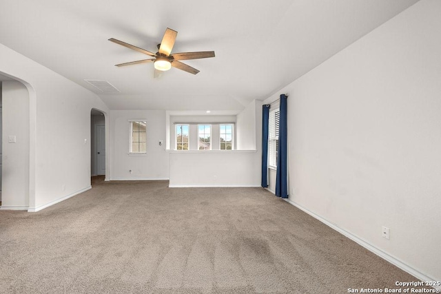 22146 Pivot Pt, San Antonio, TX 78261 - carpeted spare room featuring arched walkways, a ceiling fan, baseboards, and lofted ceiling