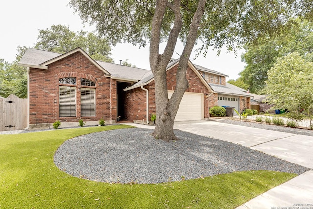13755 Cedar Cyn, San Antonio, TX 78231 - view of front of home with concrete driveway, a garage, brick siding, a gate, and roof with shingles