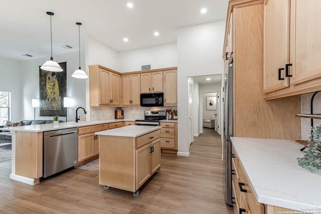 13755 Cedar Cyn, San Antonio, TX 78231 - kitchen with stainless steel appliances, light brown cabinets, a peninsula, light wood-style flooring, and recessed lighting