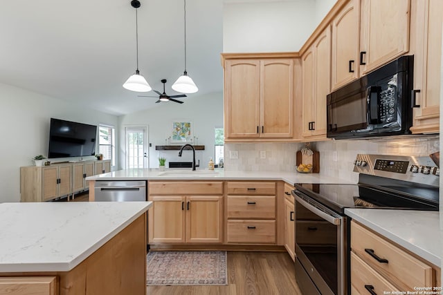 13755 Cedar Cyn, San Antonio, TX 78231 - kitchen featuring stainless steel appliances, light brown cabinetry, a sink, a peninsula, and lofted ceiling