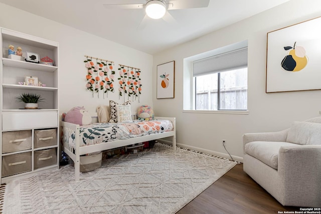 13755 Cedar Cyn, San Antonio, TX 78231 - bedroom with wood finished floors, baseboards, and ceiling fan