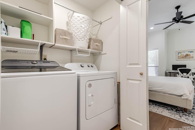 13755 Cedar Cyn, San Antonio, TX 78231 - laundry area with washing machine and clothes dryer, wood finished floors, and a ceiling fan