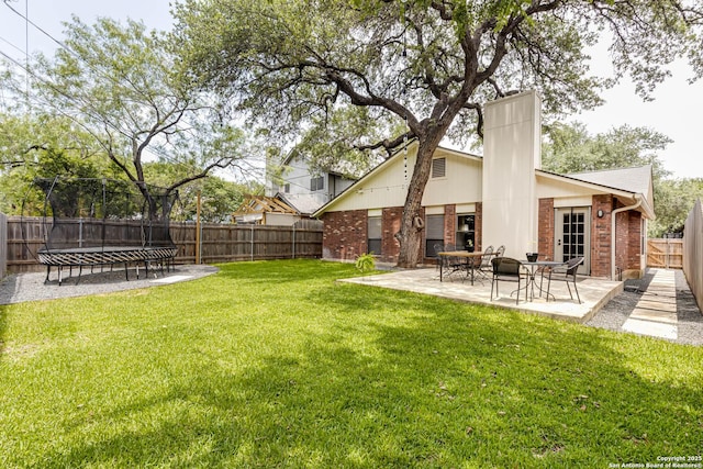 13755 Cedar Cyn, San Antonio, TX 78231 - view of yard with a trampoline and a patio area