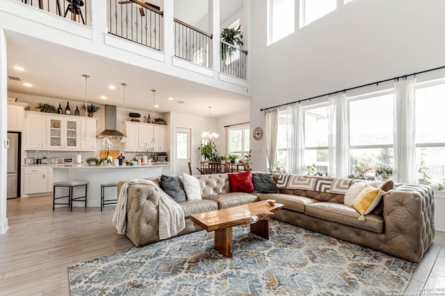 17703 San Felipe Bay, San Antonio, TX 78255 - living room with a towering ceiling, light wood finished floors, and recessed lighting