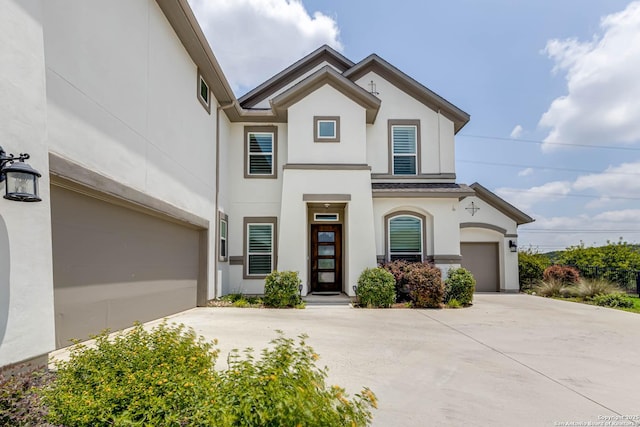 17703 San Felipe Bay, San Antonio, TX 78255 - view of front of home featuring a garage, stucco siding, and concrete driveway