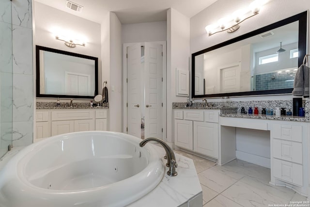 17703 San Felipe Bay, San Antonio, TX 78255 - full bathroom featuring a whirlpool tub, marble look tiles, vanity, and a walk in shower
