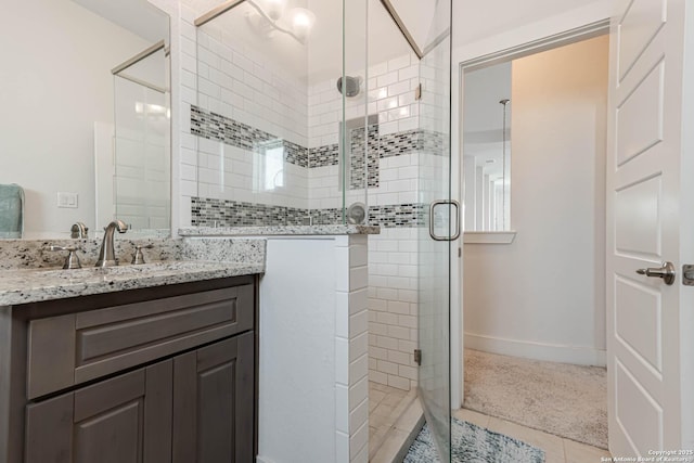 17703 San Felipe Bay, San Antonio, TX 78255 - bathroom featuring vanity, a shower stall, tile patterned floors, and baseboards
