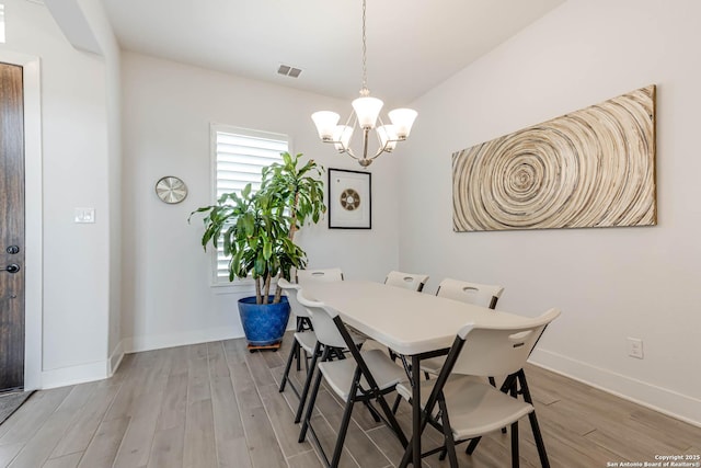 17703 San Felipe Bay, San Antonio, TX 78255 - dining area featuring a chandelier, wood finished floors, and baseboards