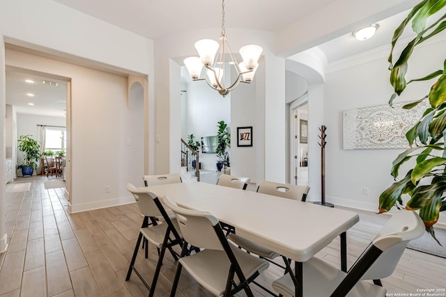 17703 San Felipe Bay, San Antonio, TX 78255 - dining area featuring a chandelier, arched walkways, light wood-style flooring, baseboards, and recessed lighting