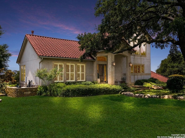 1280 Mystic Pkwy, Spring Branch, TX 78070 - rear view of house with a lawn, stucco siding, and a tiled roof