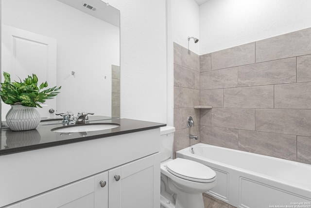 14527 Austin Hts, San Antonio, TX 78253 - bathroom with vanity, toilet, shower / bathtub combination, and wood finished floors