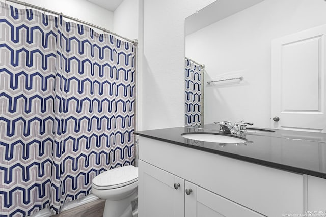 14527 Austin Hts, San Antonio, TX 78253 - full bathroom featuring vanity, toilet, curtained shower, and wood finished floors