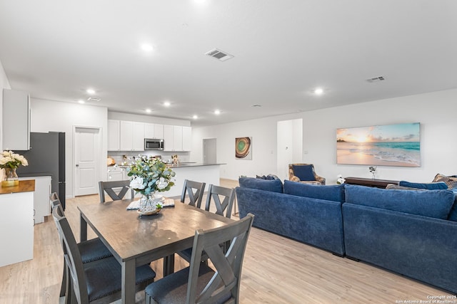 14527 Austin Hts, San Antonio, TX 78253 - dining room featuring light wood finished floors and recessed lighting