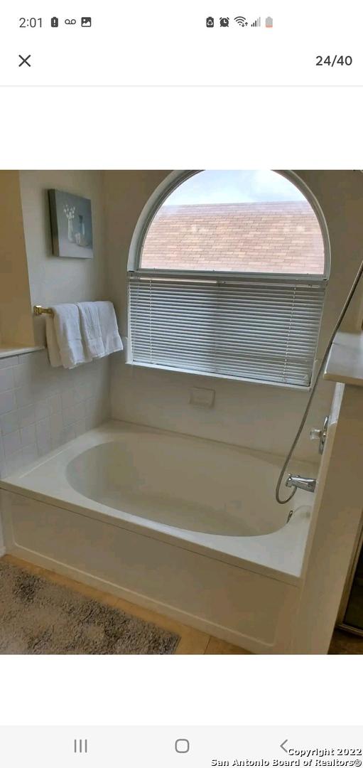 11427 Baltic Dr, San Antonio, TX 78213 - full bath with plenty of natural light and a garden tub