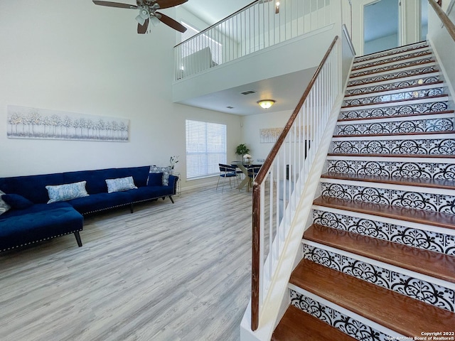 11427 Baltic Dr, San Antonio, TX 78213 - staircase featuring wood finished floors, ceiling fan, and a high ceiling